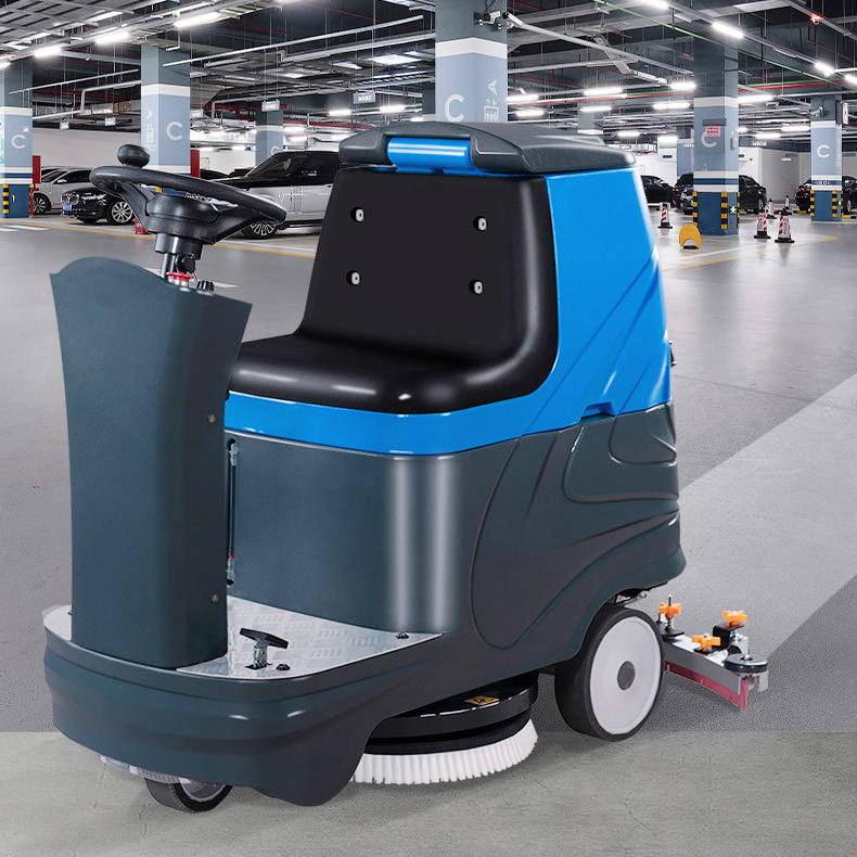 OLIFT EN760 ride-on floor scrubber in an industrial facility